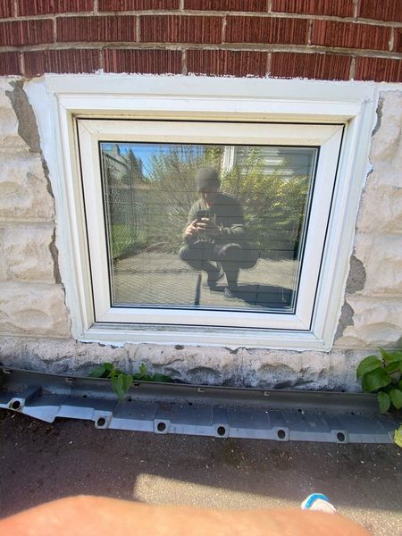 After: Basement window — surround resealed and refinished