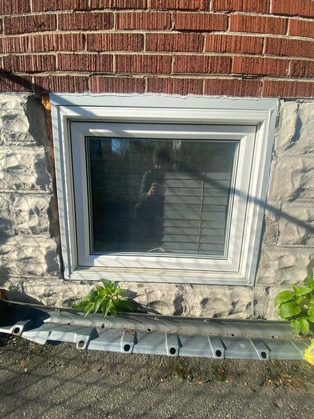 Before: Basement window — surround resealed and refinished