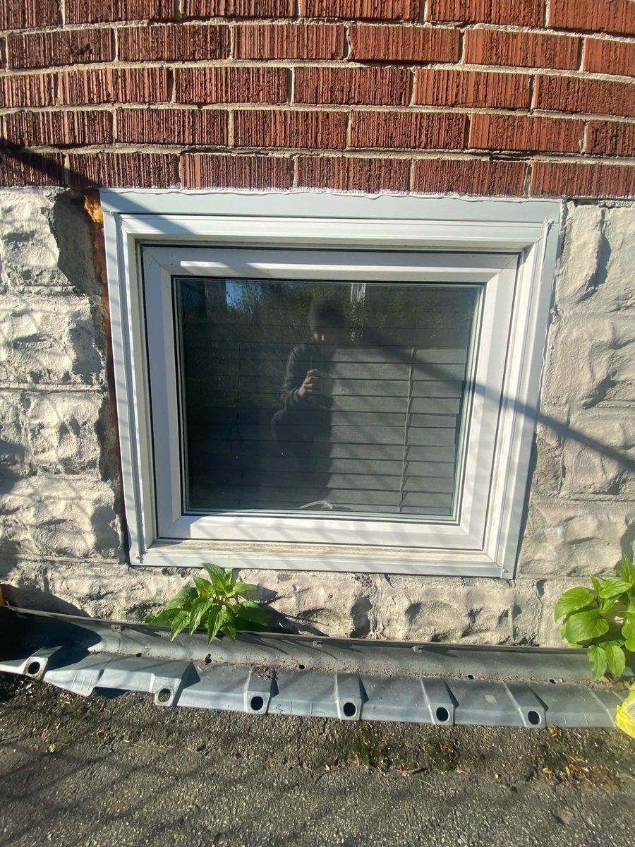 Before: Basement window — surround resealed and refinished