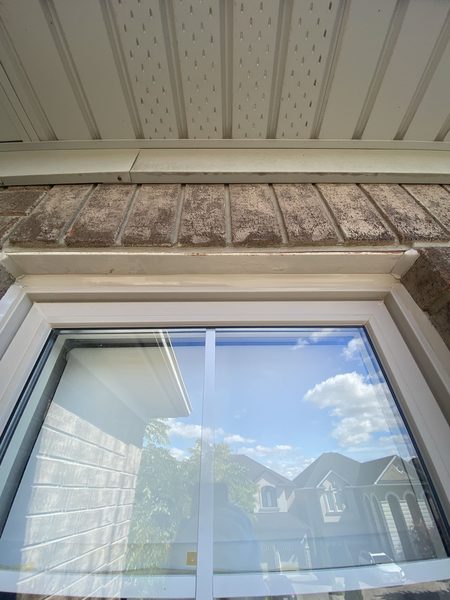 After: Brick window head — old bead out, head joint resealed