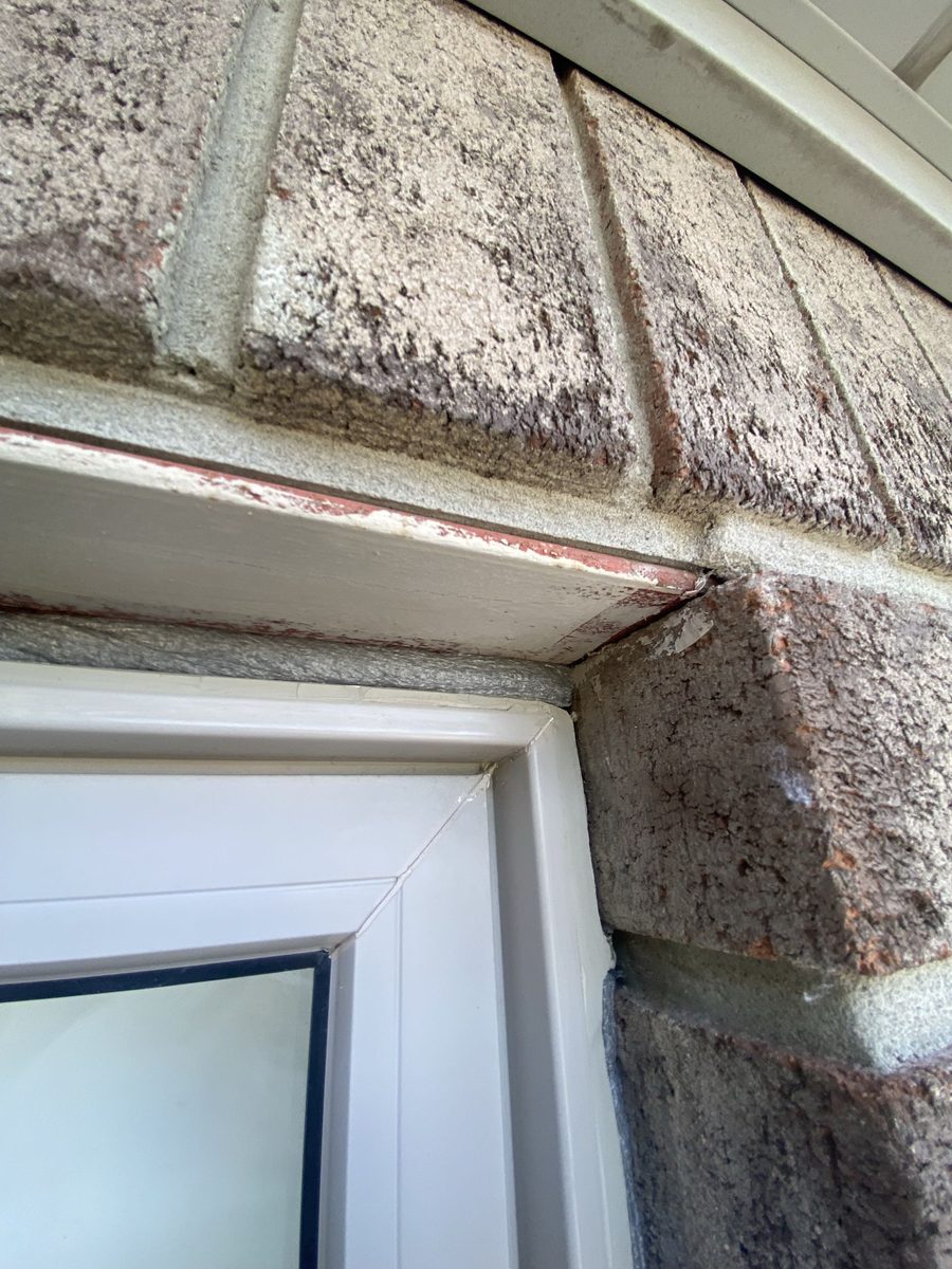 Before: Brick window head — old bead out, head joint resealed