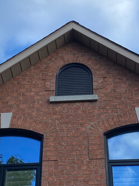 After: Gable louvre window — peeling white frame and louvre repainted black