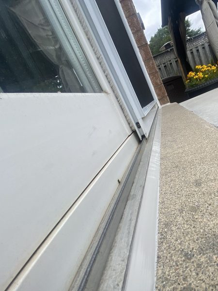 Patio door threshold to concrete sill — joint sealed