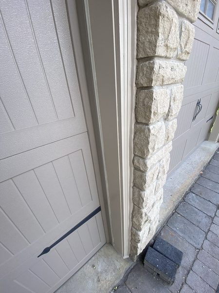 Garage door frame to stone — jamb joint sealed