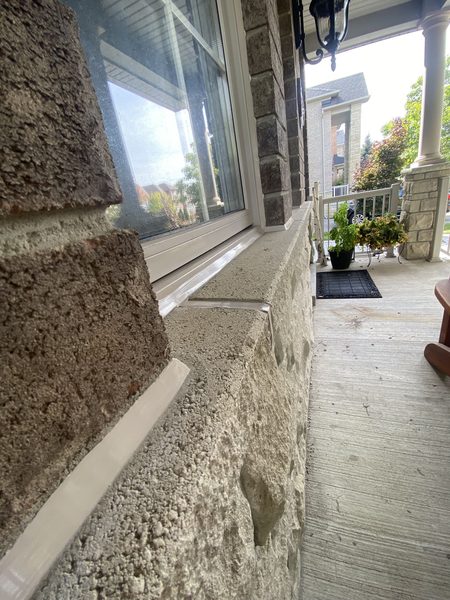 Window sill to stone at a porch — sill joint sealed