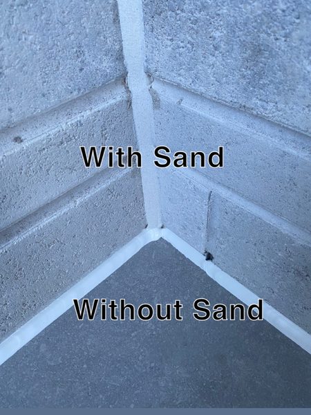 A stone corner with two finished sealant joints side by side, labelled With Sand and Without Sand — the sanded bead takes on the texture of the stone, the plain bead is smooth