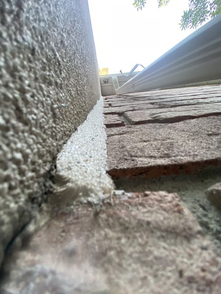 Stucco to brick paving — sealed